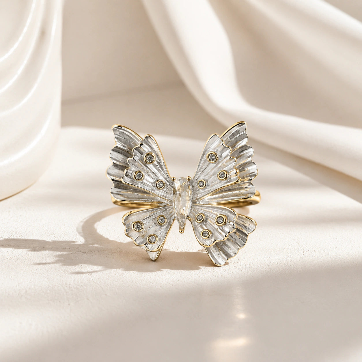 Side view of the two-tone crystal butterfly ring