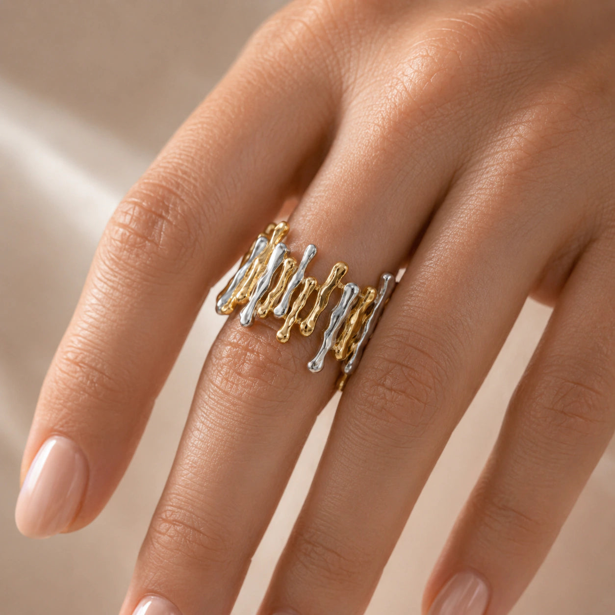 Close-up of the molten drip sculptural ring detailing