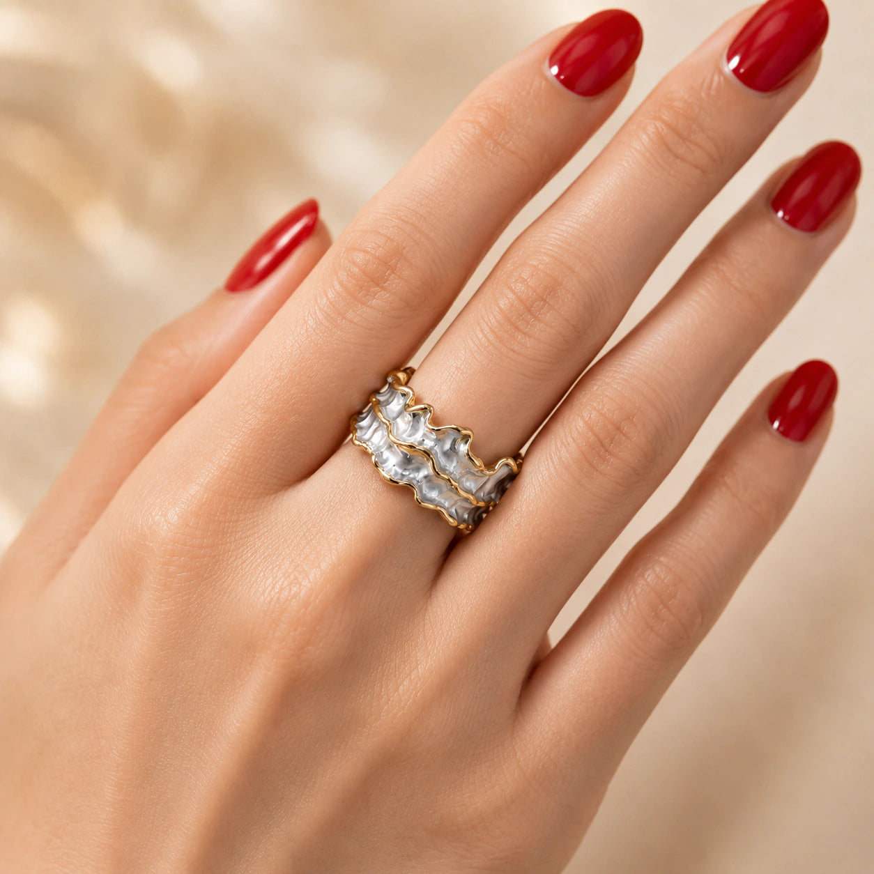Angled view of the two-tone molten wave ring