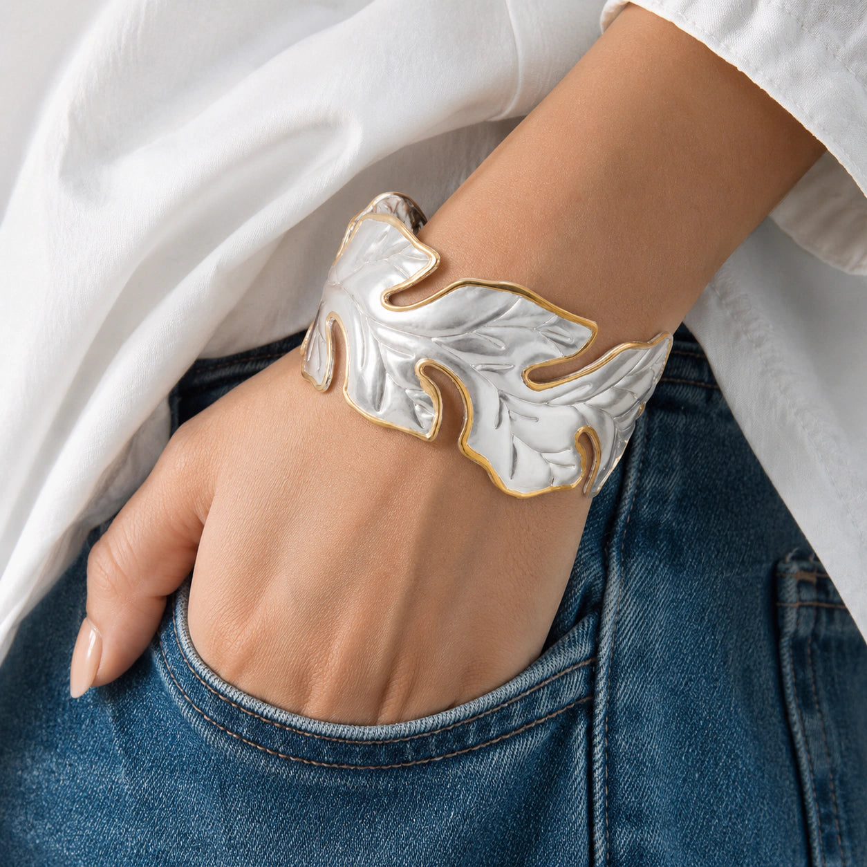 Angled view of the two-tone sculptural leaf kada