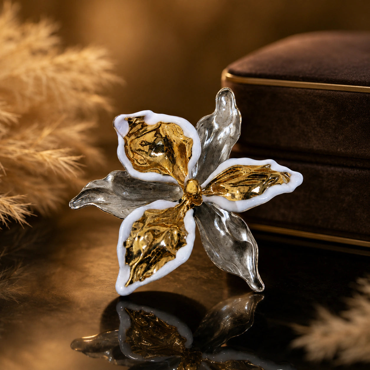 Close-up of white-edged sculptural floral ring detailing